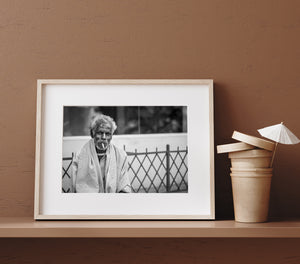 Mysore street portrait with elderly man beside metal railing