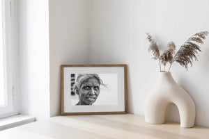 Elderly woman facing the camera against a light background