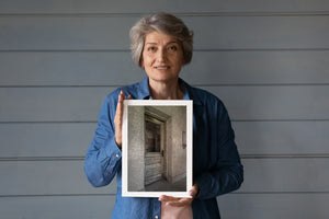 Peeling painted door surrounded by rough plaster walls