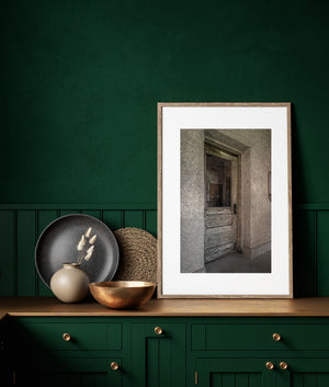 Timeworn Ellis Island doorway with cracked wood and textured walls