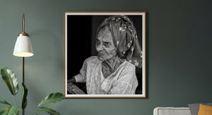 Elderly woman with expressive eyes in monochrome portrait