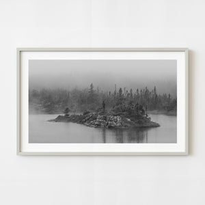 Black and white rocky island in Newfoundland fog