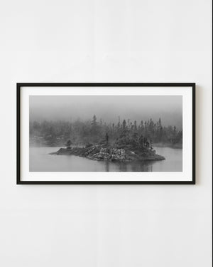 Black and white rocky island in Newfoundland fog