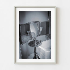 Black and white folding bathroom mirror in Gaudi building Spain