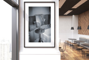 Retro bathroom fixtures and folding mirror in black and white