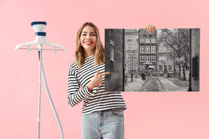 Black and white Polish city scene with pedestrian and street lamp