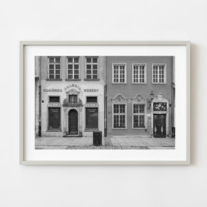 Black and white photograph of ornate storefront facades in Gdansk Poland