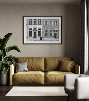 Historic Polish storefronts with sculpted entrances and weathered facades
