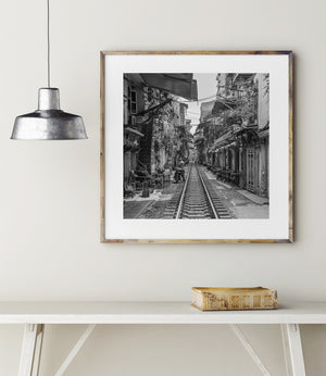 Railway passing through dense urban buildings in Hanoi Vietnam
