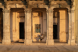 Weathered Havana facade illuminated by warm sunset light