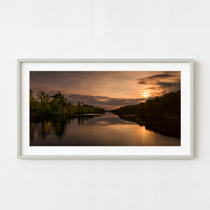 Sunset over the Intracoastal Waterway bordered by forest