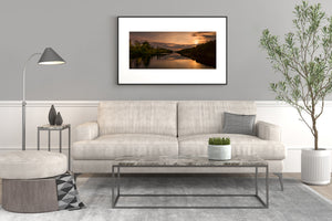 Forested shoreline framing a quiet inland waterway
