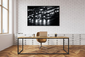Monochrome Las Vegas street scene with cars and sweeping light trails