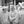 Two women in white parade costumes sharing a laugh in Tuscany