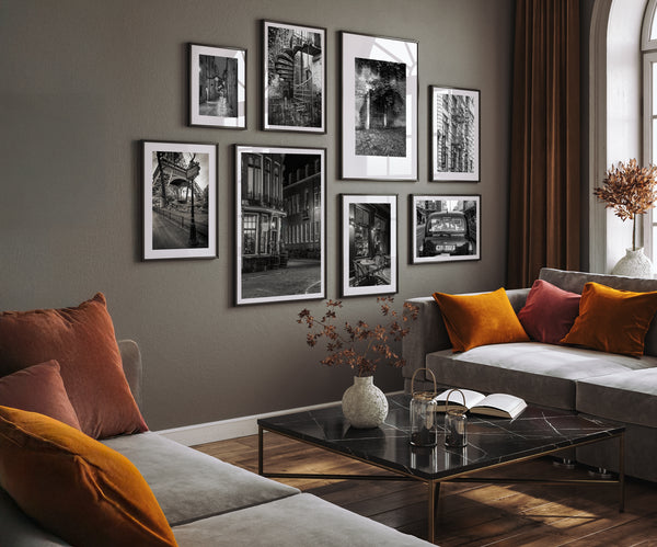 Black and white photography displayed as a gallery wall in a modern living room