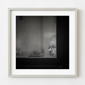 Man seen through a fogged window in Toronto black and white