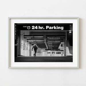 Black and white Manhattan parking garage with two men