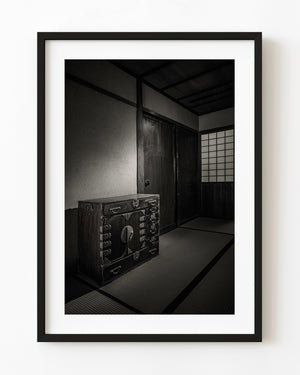 Iron-bound storage chest on tatami beside a paper screen at Matsue's Samurai Residence, Japan.