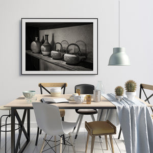 Rounded kettle bodies and tall ceramic necks form a Japanese household still life.