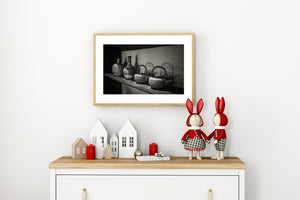Dark curved handles contrast with pale wall texture in a Japanese kitchen shelf photograph.