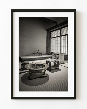 Charcoal brazier and open book in the master's private room at Matsue's Samurai Residence, Japan.