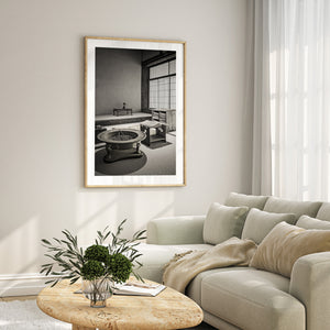 Curved metal and straight tatami borders structure a quiet Japanese domestic interior.