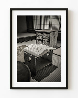 Open book on a low reading stand beside a book cabinet at Matsue's Samurai Residence, Japan.