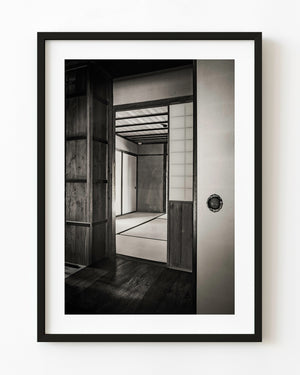 Open sliding doorway framing a tatami room at Matsue's Samurai Residence, Japan, in black and white.