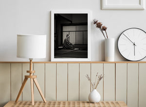 Black and white view of a formal Japanese reception room with a seated samurai display figure.