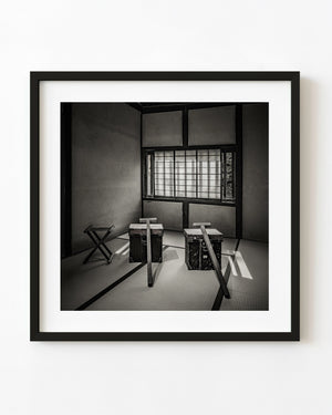 Two travelling chests with long carrying poles on tatami at Matsue's Samurai Residence, Japan.