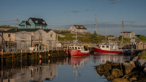 Quiet Nova Scotia fishing village with boats and reflections