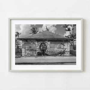 Black and white graffiti woman on abandoned building in Nassau Bahamas