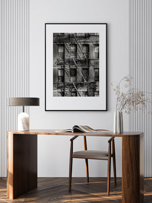 Urban brick architecture with repeating windows and iron fire escapes