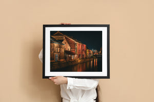 Warm evening light on historic canal warehouses in Hokkaido