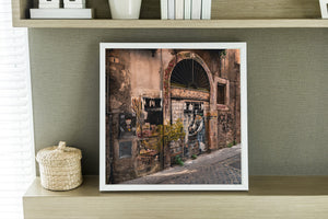 Weathered urban architecture and painted garage door in Italy