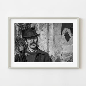 Black and white portrait of a Romanian man in Sighisoara