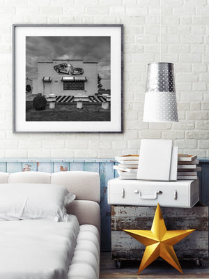 Sports car wall mural illuminated by an exterior lamp
