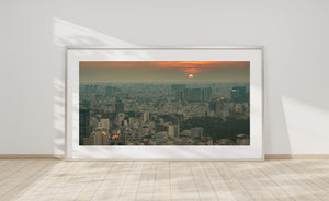 Warm sunset glow over high-rise buildings and rooftops in Saigon