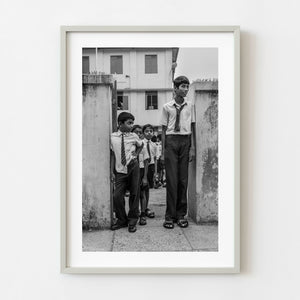 Schoolboys outside a school in Kochi India black and white