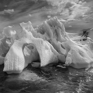 Antarctic iceberg with large eroded ice arches
