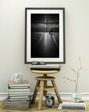 Geometric airport passageway with solitary silhouetted person