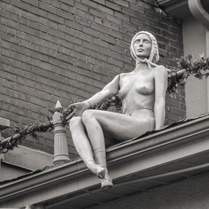 Black and white Toronto photograph of seated mannequin