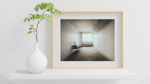 Abstract room interior with blurred chair and window light