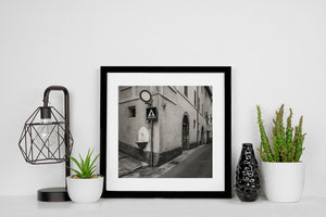 Monochrome architectural photograph of plaster walls shutters and wooden doorways