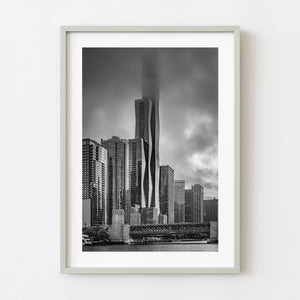 Black and white St. Regis Chicago skyscraper disappearing into low fog