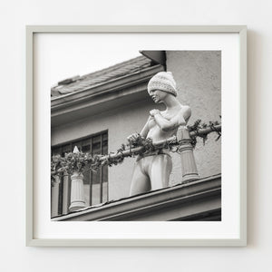 Standing rooftop mannequin wearing knit hat in Toronto