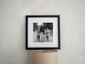 Black and white Tibetan family street photograph in China