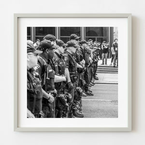 Black and white photograph of a long police line in Toronto
