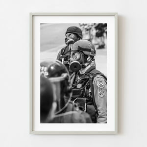Toronto police officer wearing gas mask during G20 summit