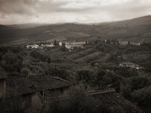 Weathered terracotta rooftops overlooking a small Tuscan village